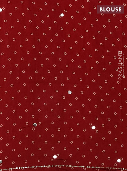 Muslin silk saree red shade with allover zigzag prints and sequin mirror work embroidery pallu