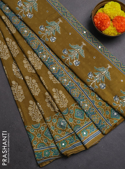 Muslin silk saree mehendi green with allover butta prints and sequin mirror work embroidery pallu