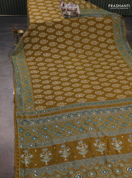 Muslin silk saree mehendi green with allover butta prints and sequin mirror work embroidery pallu