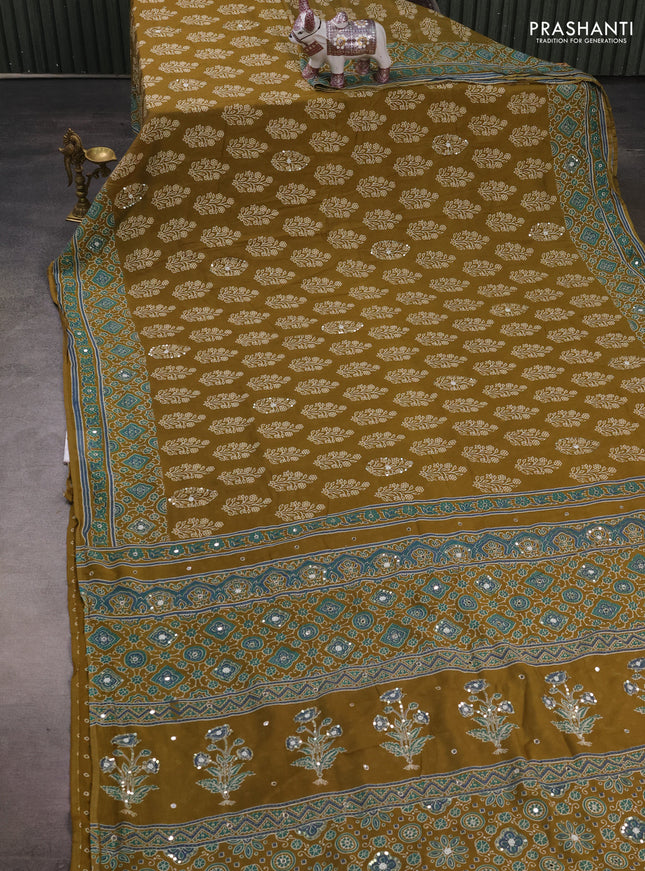 Muslin silk saree mehendi green with allover butta prints and sequin mirror work embroidery pallu