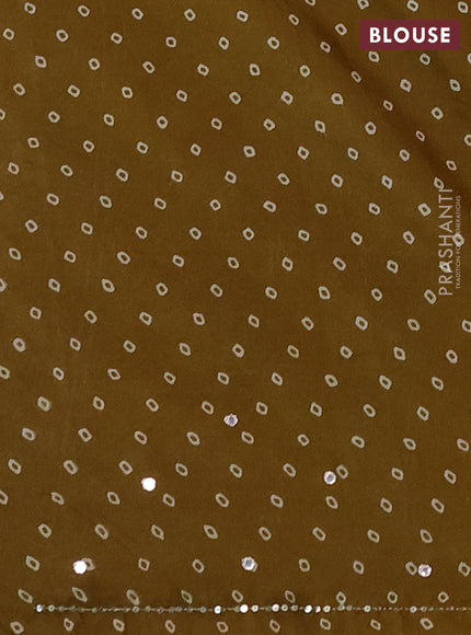 Muslin silk saree mehendi green with allover butta prints and sequin mirror work embroidery pallu