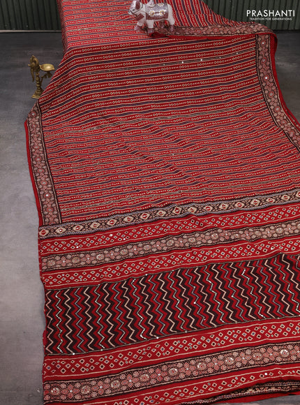 Muslin silk saree red shade with allover geometric prints and sequin mirror work embroidery pallu