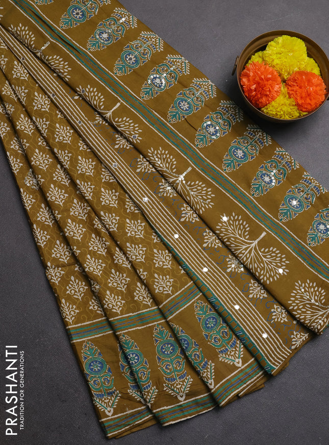 Muslin silk saree mehendi green with allover dabu butta prints and sequin mirror work embroidery pallu