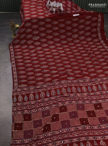Muslin silk saree red shade with allover butta prints and sequin mirror work embroidery pallu