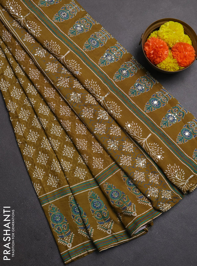 Muslin silk saree mehendi green and red with allover dabu butta prints and sequin mirror work embroidery pallu