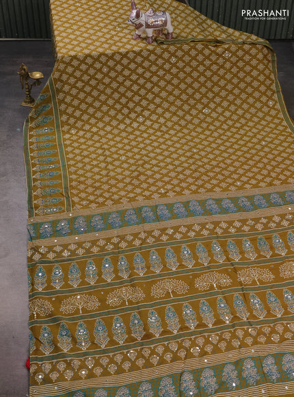 Muslin silk saree mehendi green and red with allover dabu butta prints and sequin mirror work embroidery pallu