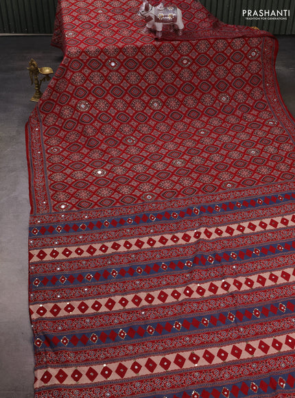 Muslin silk saree red shade with allover ajrakh butta prints and sequin mirror work embroidery pallu