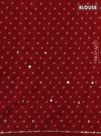 Muslin silk saree red shade with allover ajrakh butta prints and sequin mirror work embroidery pallu