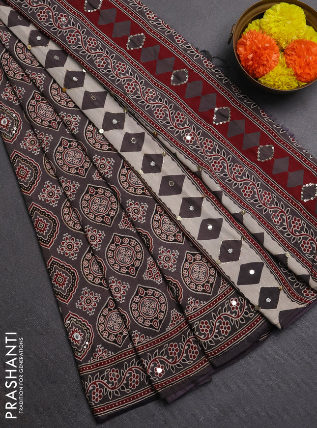 Muslin silk saree grey shade with allover ajrakh prints and sequin mirror work embroidery pallu