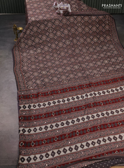 Muslin silk saree grey shade with allover ajrakh prints and sequin mirror work embroidery pallu