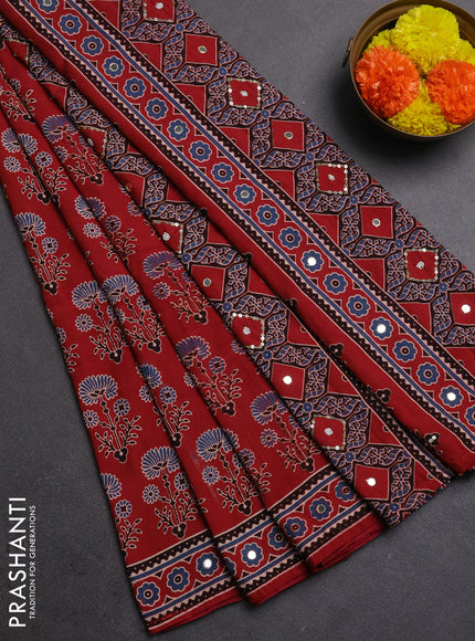 Muslin silk saree red shade with allover ajrakh butta prints and sequin mirror work embroidery pallu