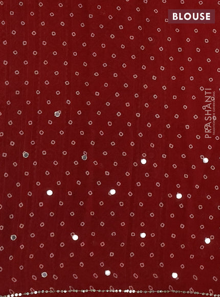 Muslin silk saree red shade with allover ajrakh butta prints and sequin mirror work embroidery pallu