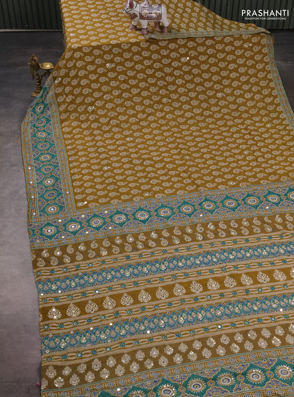Muslin silk saree mehendi green and teal green with allover dabu butta prints and sequin mirror work embroidery pallu