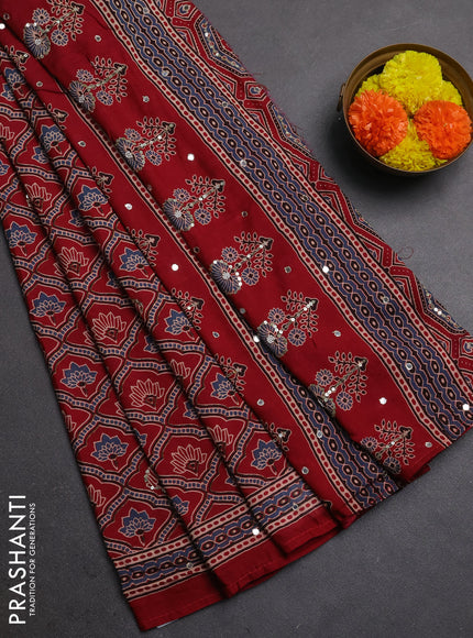 Muslin silk saree red shade with allover ajrakh prints and sequin mirror work embroidery pallu