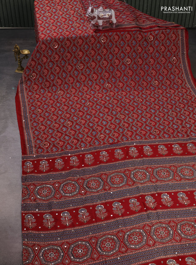 Muslin silk saree red shade with allover ajrakh prints and sequin mirror work embroidery pallu