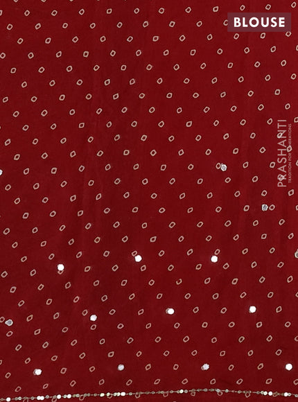 Muslin silk saree red shade with allover ajrakh prints and sequin mirror work embroidery pallu