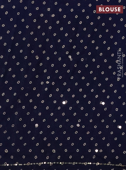 Muslin silk saree indigo blue with allover ajrakh prints and sequin mirror work embroidery pallu