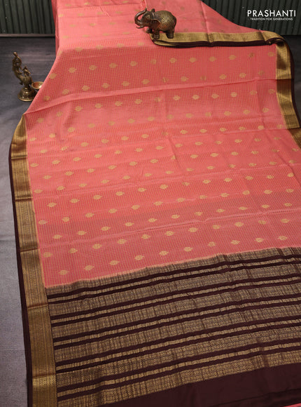 Pure mysore silk peach shade and coffee brown with allover small zari checks & buttas and zari woven border