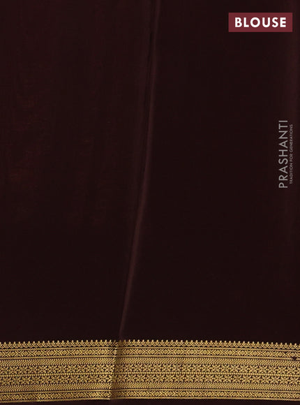 Pure mysore silk peach shade and coffee brown with allover small zari checks & buttas and zari woven border