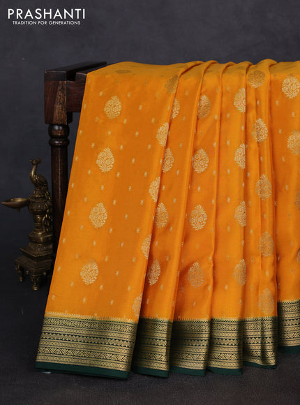 Pure mysore silk mango yellow and bottle green with allover zari woven buttas and zari woven border