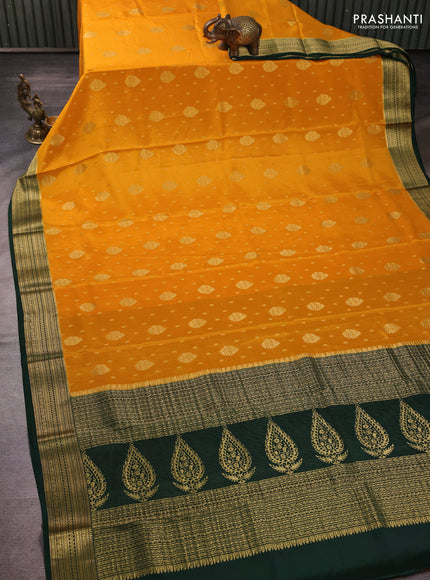 Pure mysore silk mango yellow and bottle green with allover zari woven buttas and zari woven border