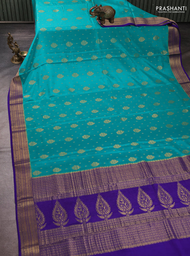 Pure mysore silk teal blue and violet with allover zari woven buttas and zari woven butta border