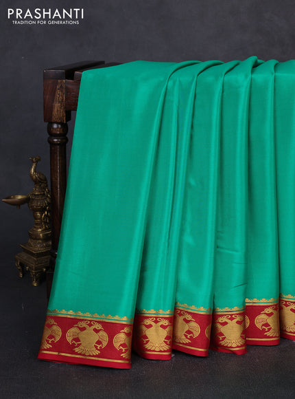 Pure mysore silk teal green and maroon with plain body and zari woven butta border