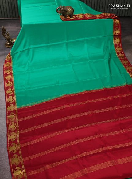 Pure mysore silk teal green and maroon with plain body and zari woven butta border
