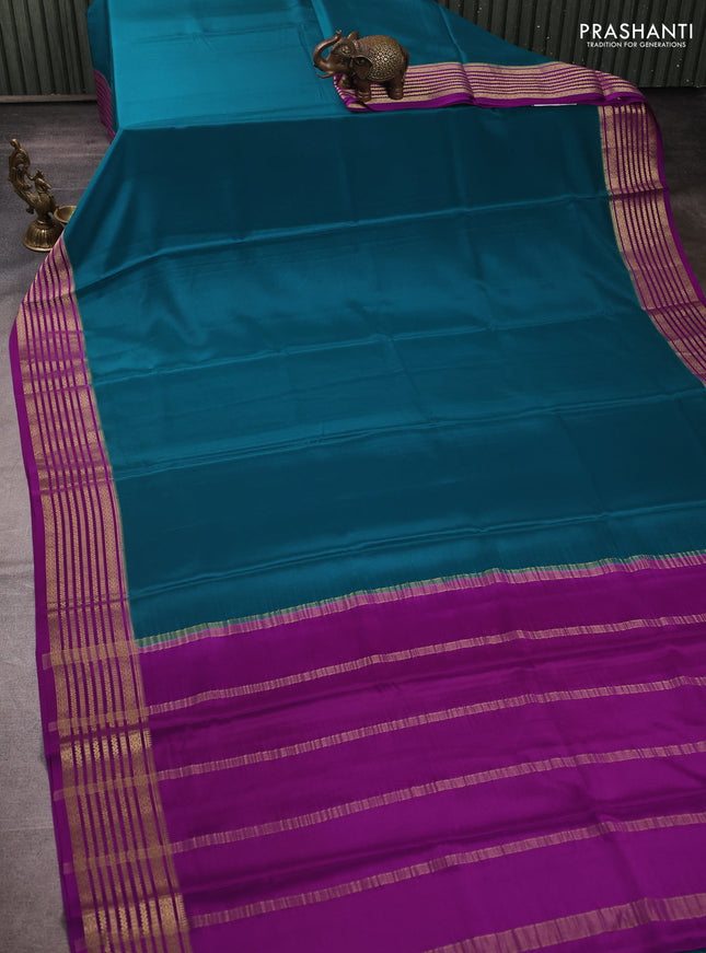 Pure mysore silk peacock green and purple with plain body and zari woven border