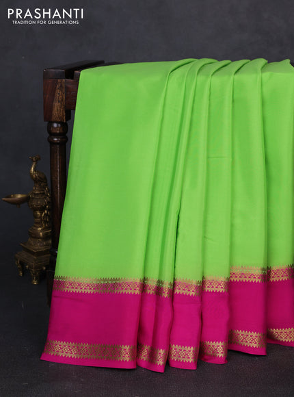 Pure mysore silk fluorescent green and pink with plain body and rettapet zari woven border