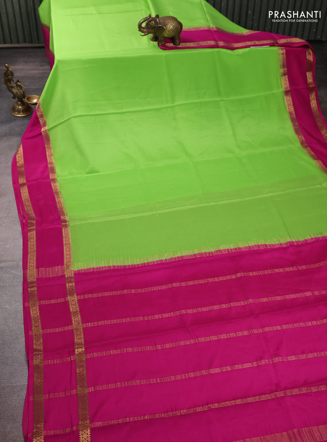 Pure mysore silk fluorescent green and pink with plain body and rettapet zari woven border