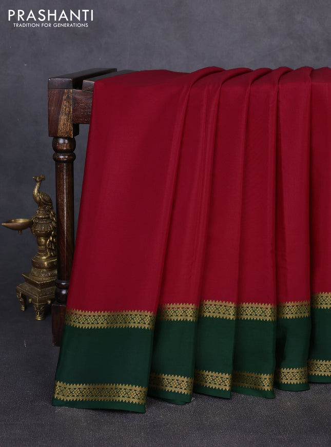 Pure mysore silk maroon and bottle green with plain body and rettapet zari woven border