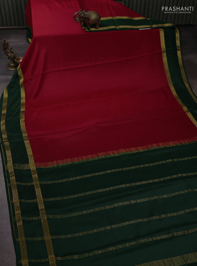 Pure mysore silk maroon and bottle green with plain body and rettapet zari woven border