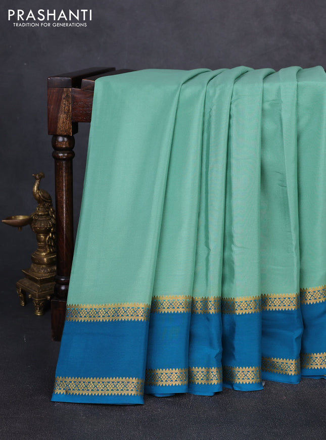 Pure mysore silk pastel green and teal blue with plain body and rettapet zari woven border