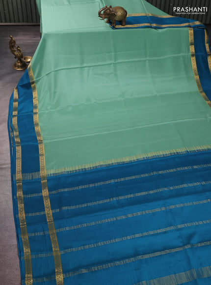 Pure mysore silk pastel green and teal blue with plain body and rettapet zari woven border