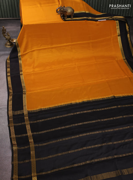 Pure mysore silk mustard yellow and black with plain body and rettapet zari woven border