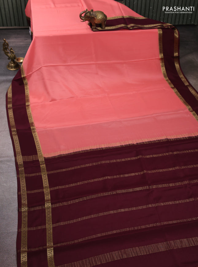 Pure mysore silk peach shade and coffee brown with plain body and rettapet zari woven border