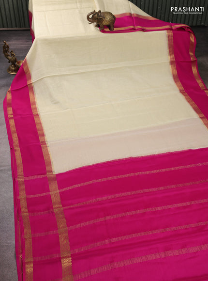 Pure mysore silk cream and pink with allover small zari checked pattern and rettapet zari woven border