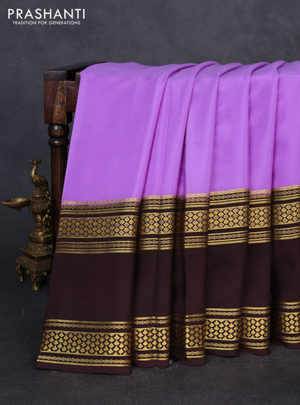 Pure mysore silk lavender and coffee brown with plain body and rettapet zari woven border