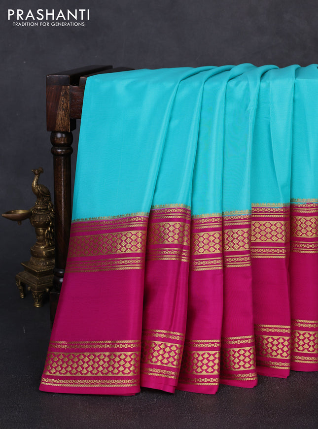 Pure mysore silk teal green and pink with plain body and rettapet zari woven border