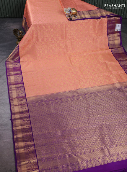 Pure kanchipuram silk saree peach pink and purple with allover zari woven brocade weaves and rich zari woven border