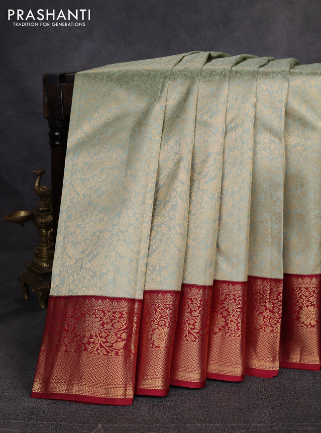 Pure kanchipuram silk saree pista green and maroon with allover zari woven brocade weaves and zari woven korvai border