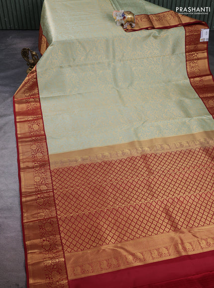 Pure kanchipuram silk saree pista green and maroon with allover zari woven brocade weaves and zari woven korvai border