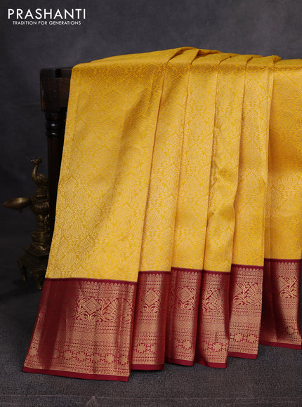Pure kanchipuram silk saree yellow and maroon with allover zari woven brocade weaves and zari woven korvai border