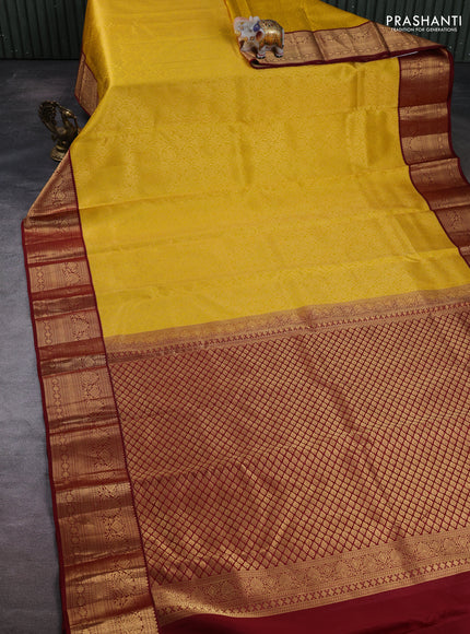 Pure kanchipuram silk saree yellow and maroon with allover zari woven brocade weaves and zari woven korvai border