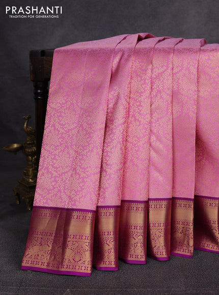 Pure kanchipuram silk saree light pink and purple with allover zari woven brocade weaves and zari woven border