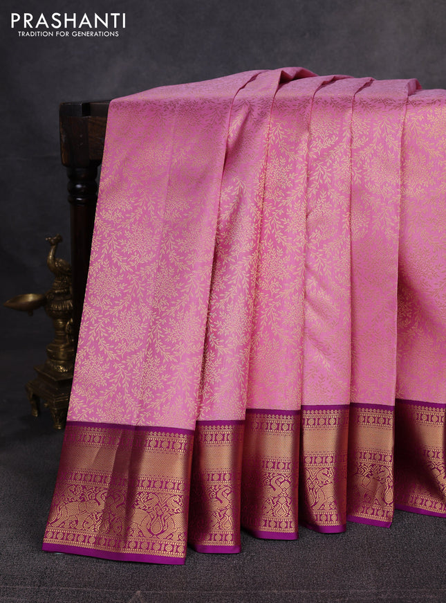 Pure kanchipuram silk saree light pink and purple with allover zari woven brocade weaves and zari woven border