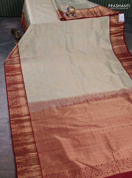 Pure kanchipuram silk saree mild pista green and maroon with allover zari woven brocade weaves and rich zari woven border