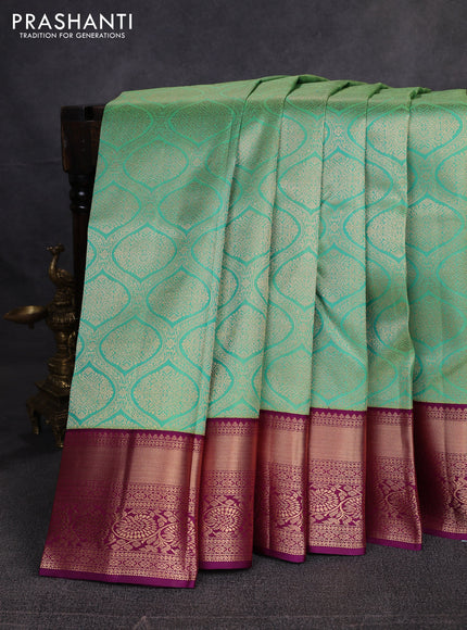 Pure kanchipuram silk saree teal green and purple with allover zari woven brocade weaves and rich zari woven border