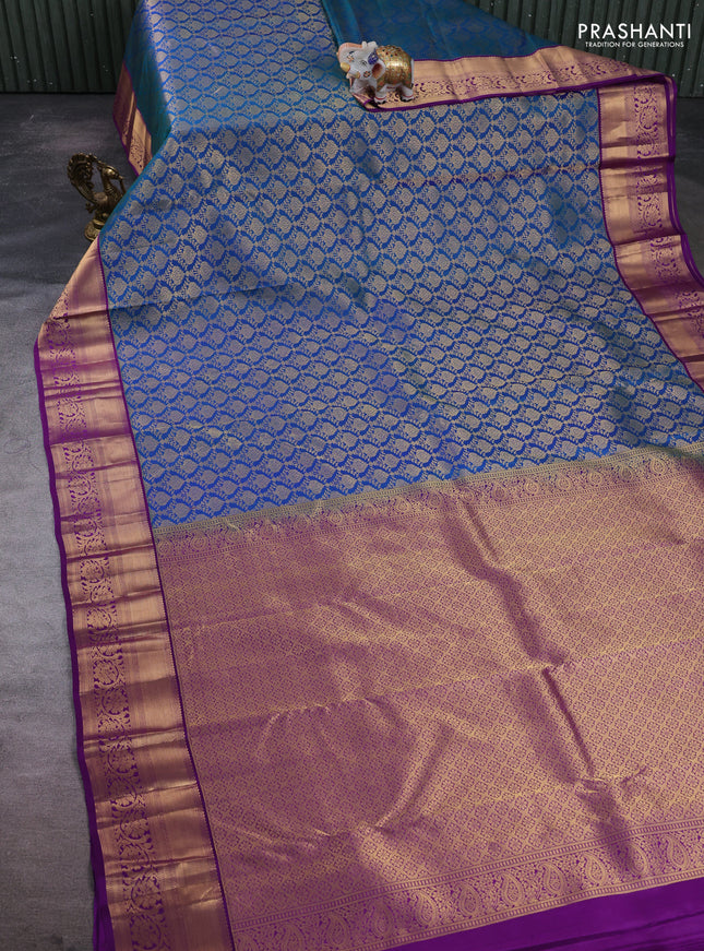 Pure kanchipuram silk saree peacock blue and purple with allover zari woven brocade weaves and rich zari woven border